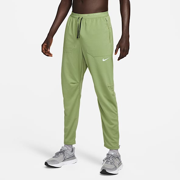 Green nike track pants on sale